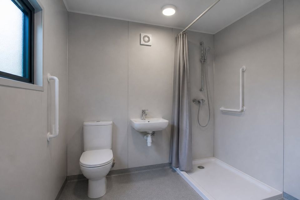 Combined WC and shower cubicle inside a portable sanitary cabin