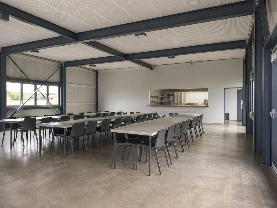 Prefab community dining and social space with coordinated service and accessible circulation