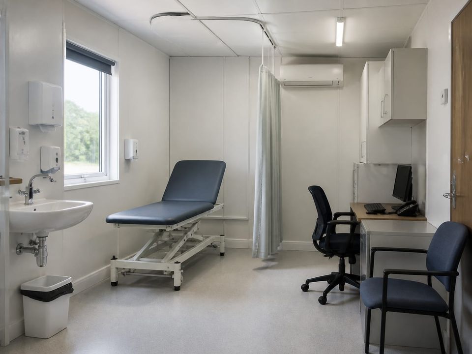 Prefab healthcare consultation room planned for privacy, examination, hand hygiene, and accessible patient movement