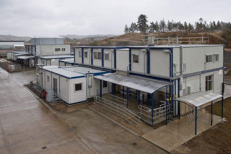 Purpose-built modular container units arranged as an organized site facility
