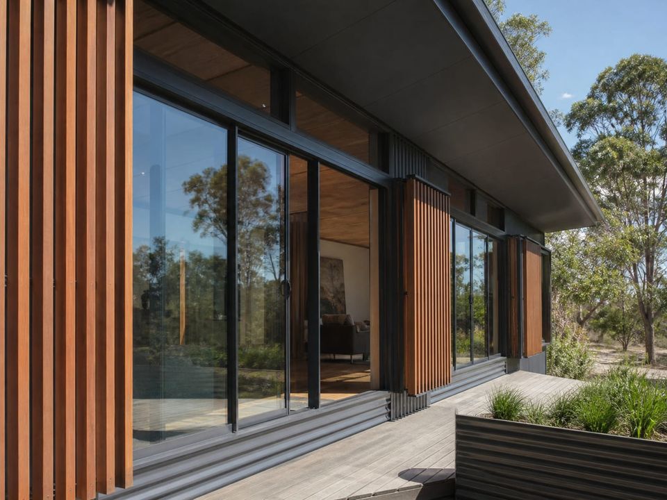 Premium steel home façade with large-format glazing and integrated shading