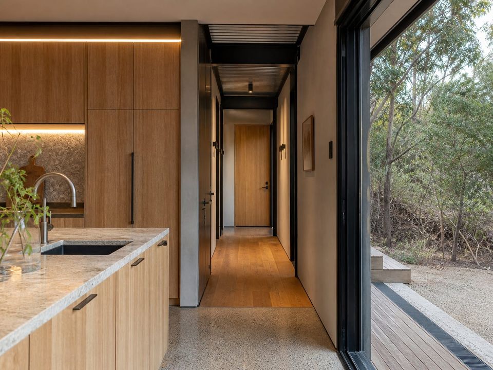 Premium steel home interior with coordinated joinery, lighting, and finishes