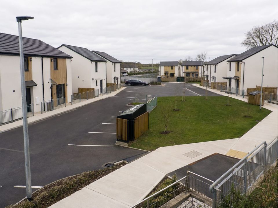 Affordable housing scheme layout with footpaths, parking, and shared open space