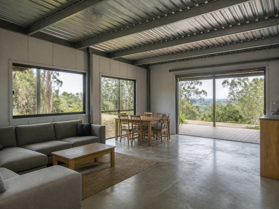 Single-storey steel home living area with daylight, outlook, and open circulation