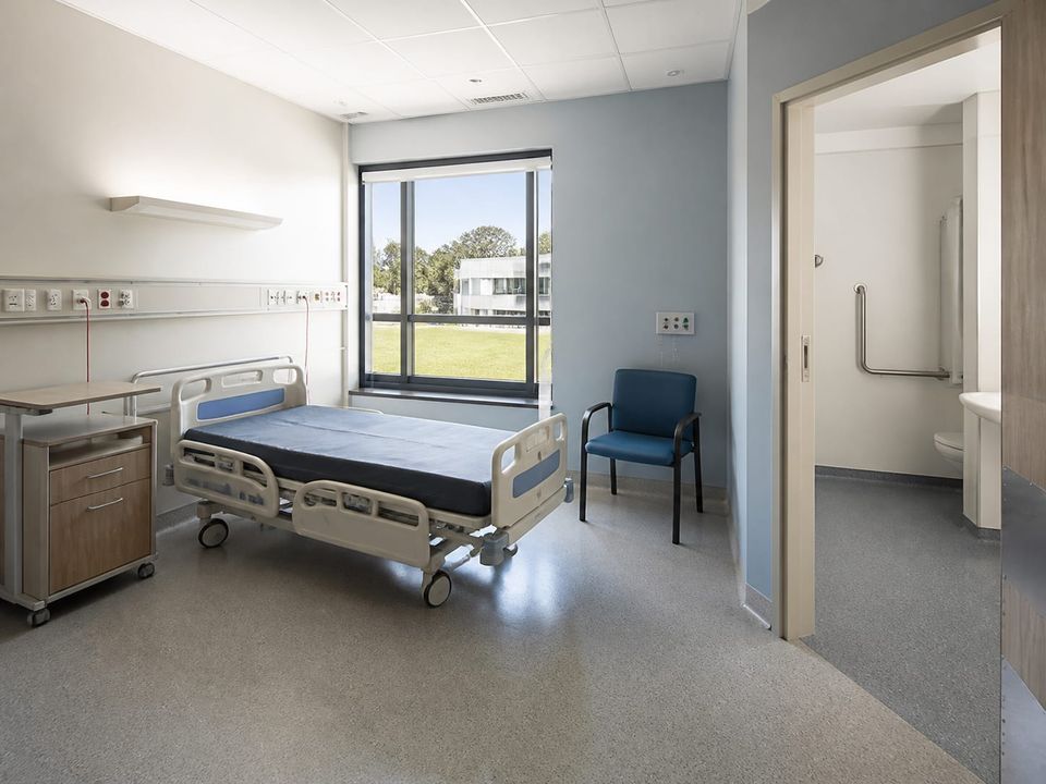 Prefab patient room coordinated with observation, privacy, accessible sanitary provision, clinical services, and family needs