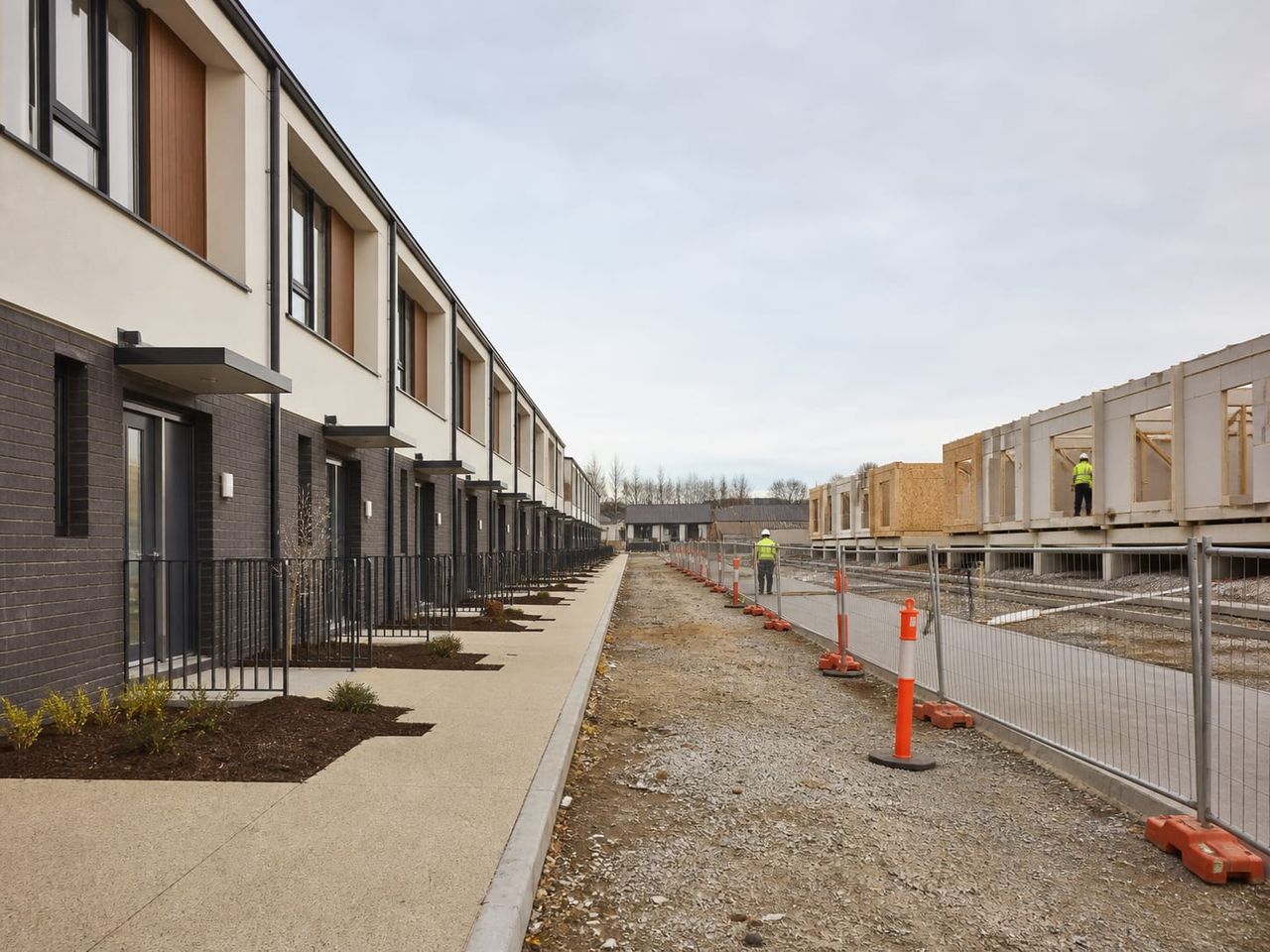 Affordable housing scheme under phased construction with completed blocks occupied