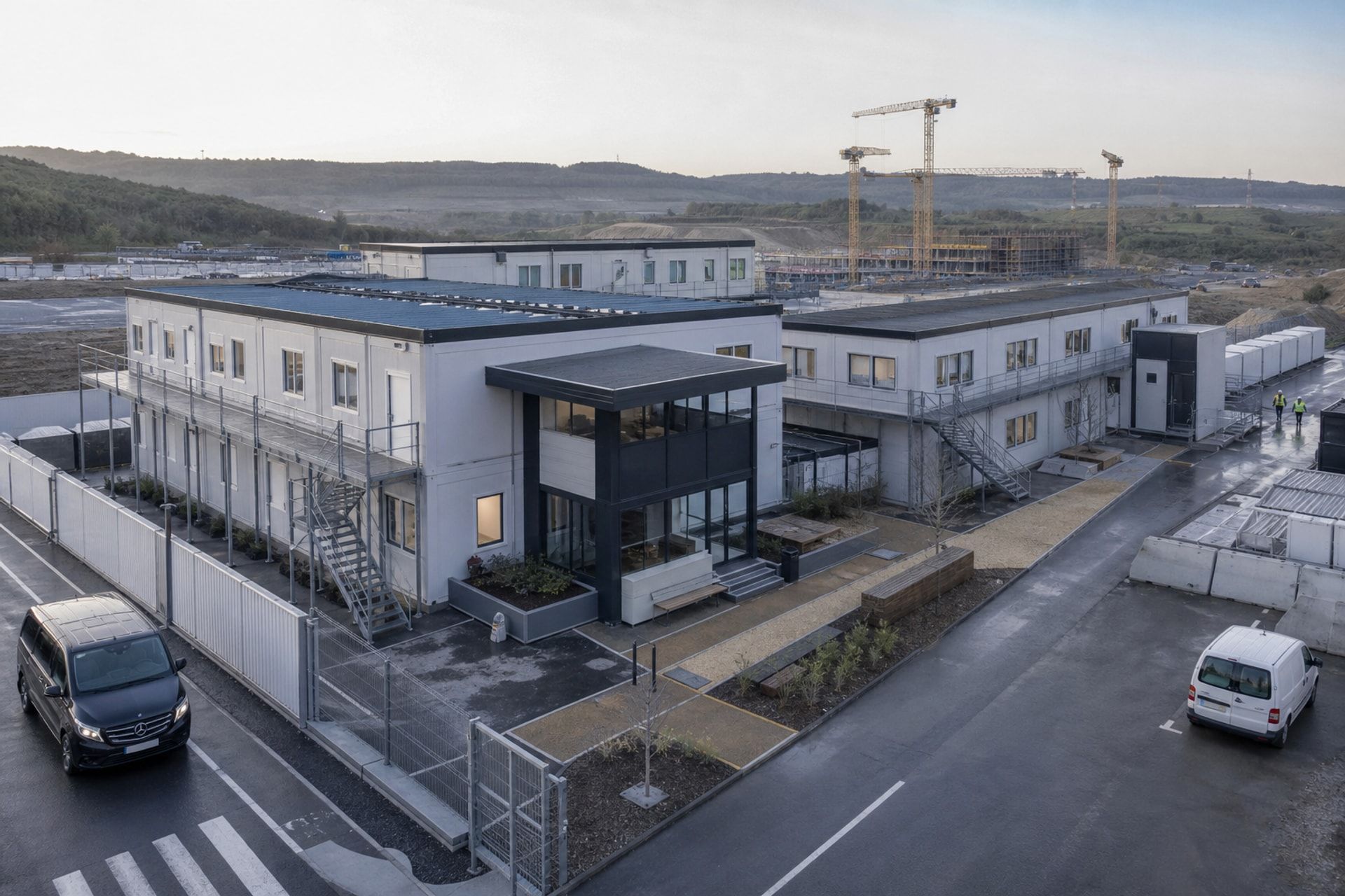 Organised modular site office campus beside an active construction project