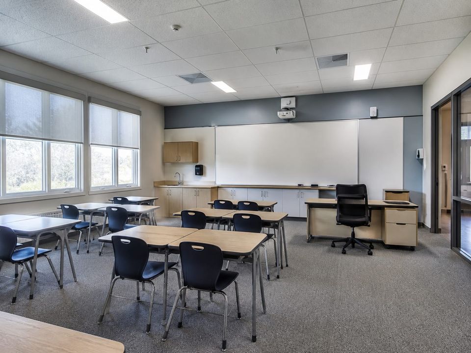 Prefab classroom planned for clear teaching sightlines, daylight, acoustic comfort, and accessible circulation