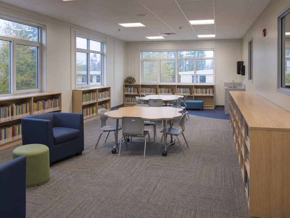 Prefab school library and study area arranged for quiet learning and supervised group work
