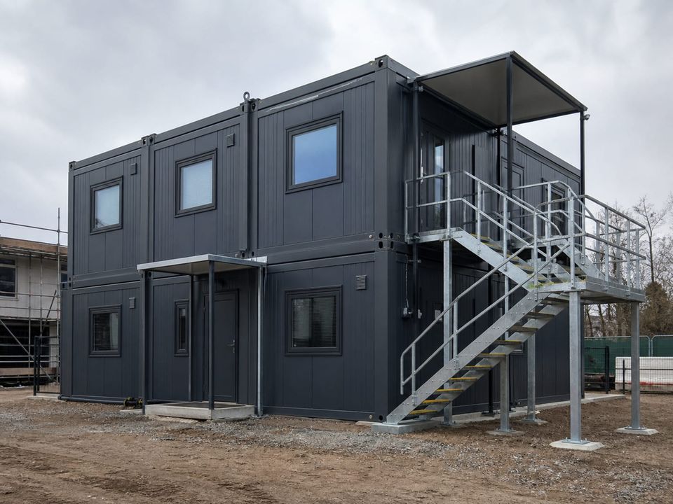 Two-storey container office complex with external stairs, landings, and guarding