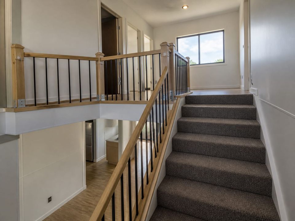 Prefab home staircase and landing with balustrade and natural light